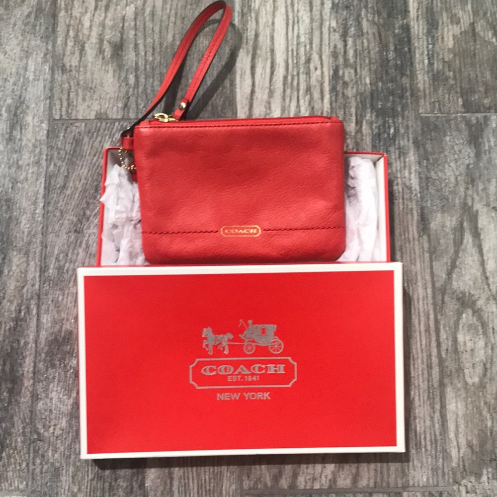 Used Coach Wristlet with original packaging
